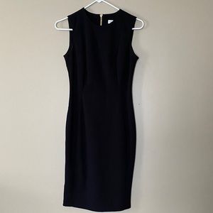 Black sleeveless sheath dress